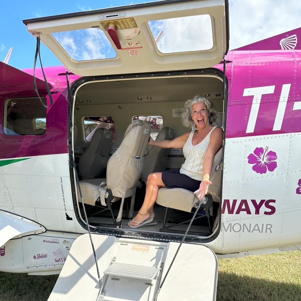 Mireille in a Green Airways plane