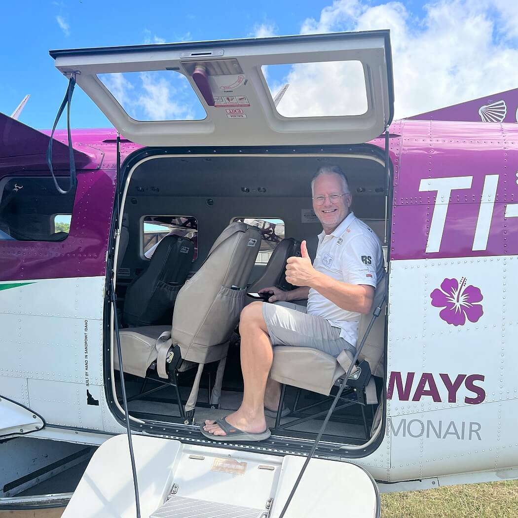 Pieter giving the thumbs up in a Green Airways plane