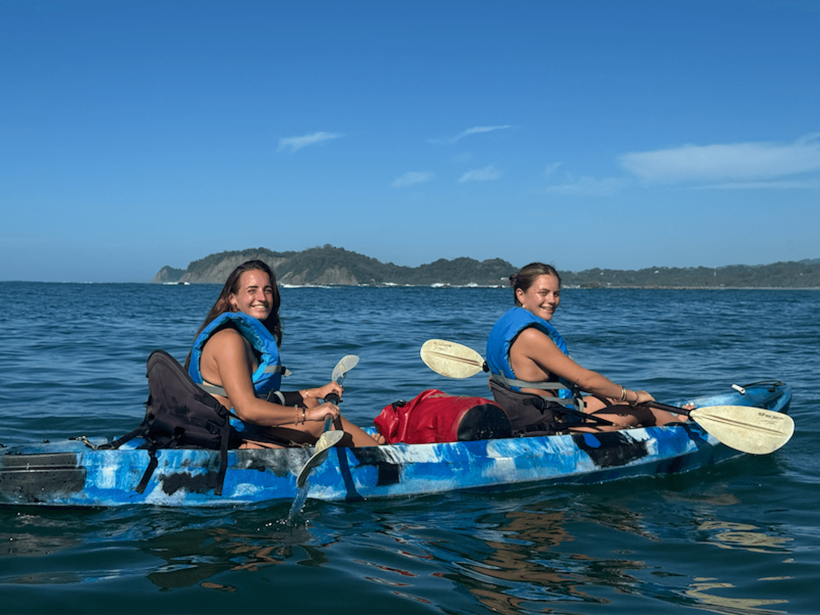 Girls are having fun kayaking in Samara Beach